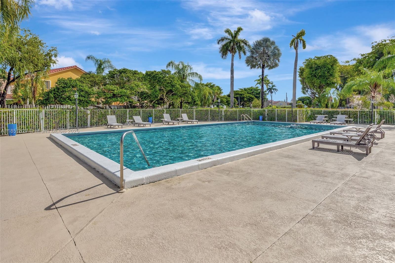 15224 Southwest 111th Street Miami, FL 33196 - Photo 27 of 27 a view of a backyard with a garden and palm trees