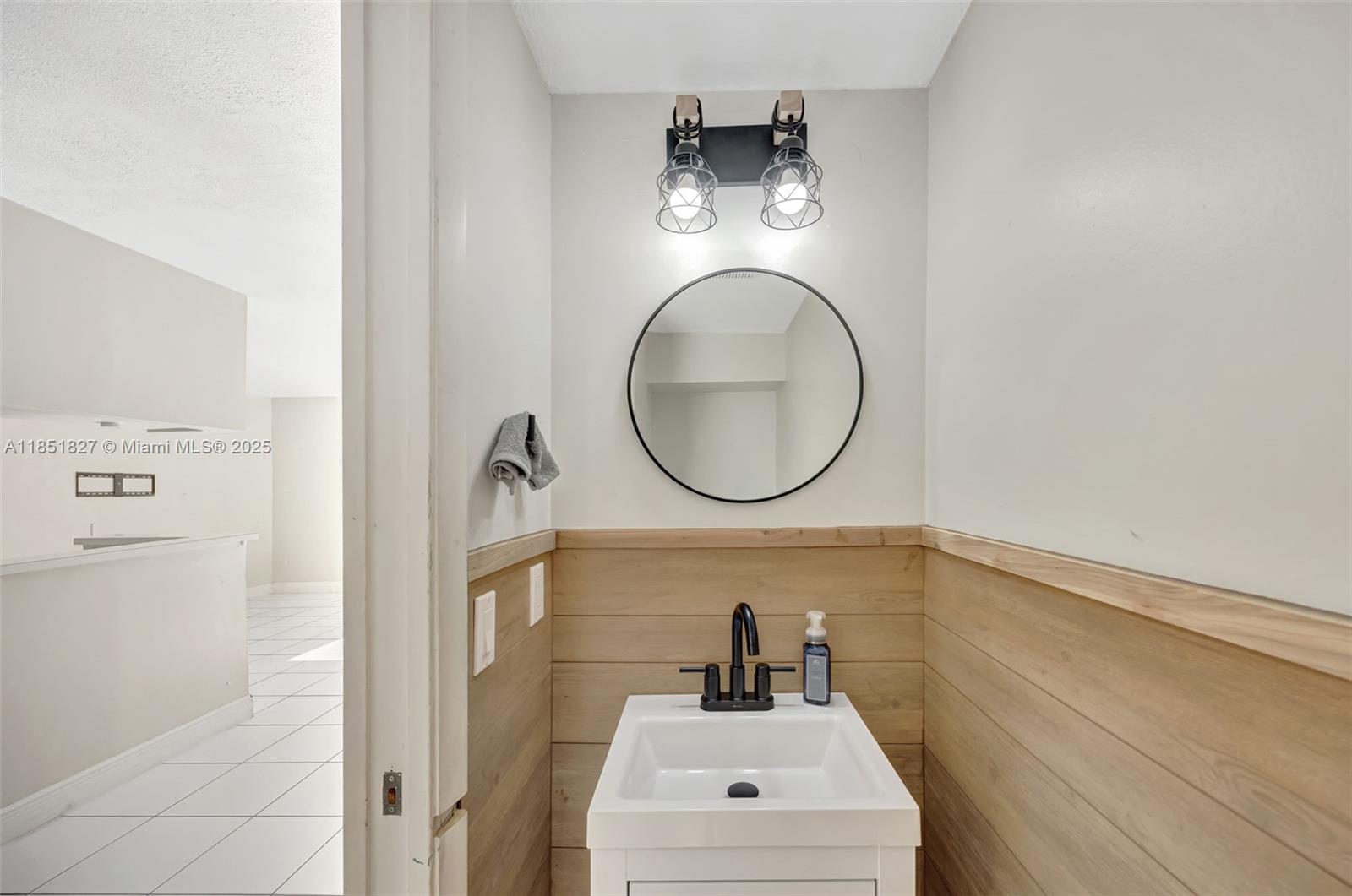 15224 Southwest 111th Street Miami, FL 33196 - Photo 6 of 27 a bathroom with a sink and a mirror