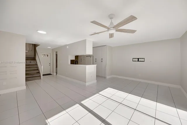 a view of a livingroom with a staircase