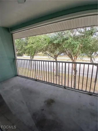 a view of a porch with a floor to ceiling window