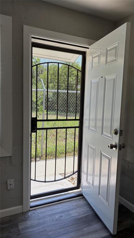 260 South Corinth St Road, Unit 238 Dallas, TX 75203 - Photo 11 of 14 Doorway with healthy amount of natural light and wood finished floors