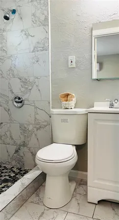 a bathroom with a toilet and a sink
