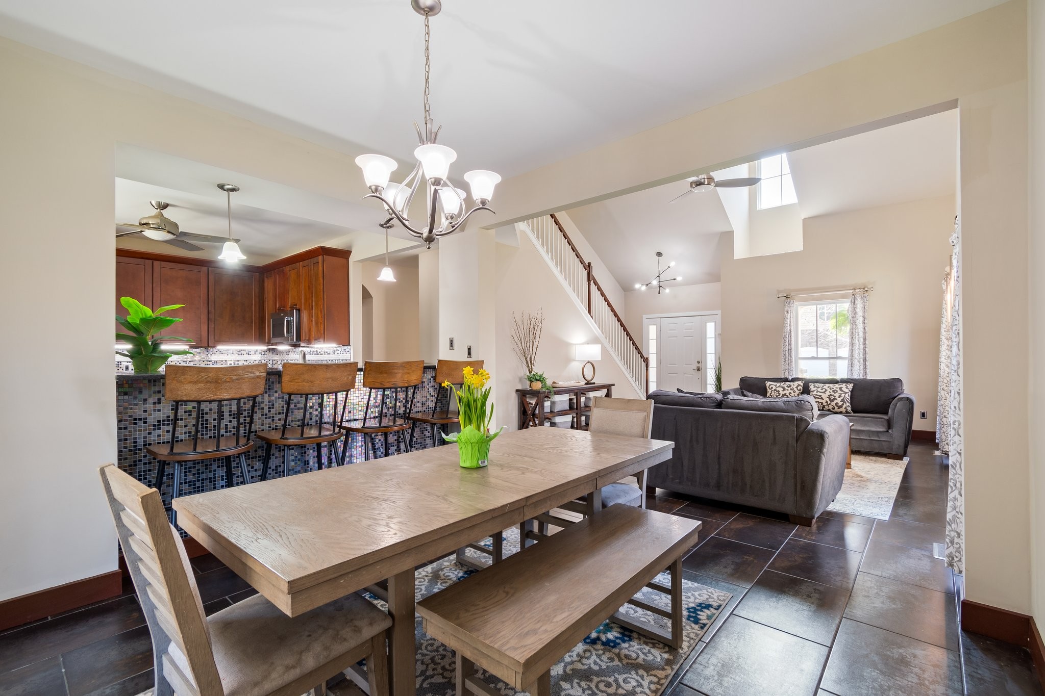 7245 Riverfront Drive Nashville, TN 37221 - Photo 13 of 74 a view of a dining room with furniture a chandelier and wooden floor