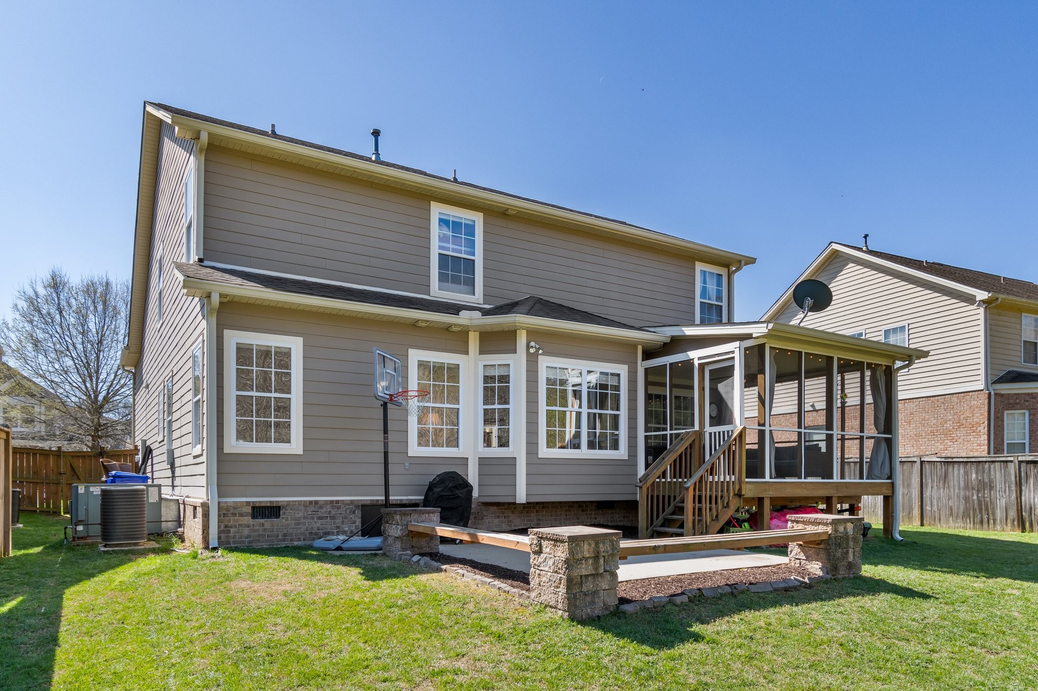 7245 Riverfront Drive Nashville, TN 37221 - Photo 28 of 74 a front view of a house with a yard table and chairs