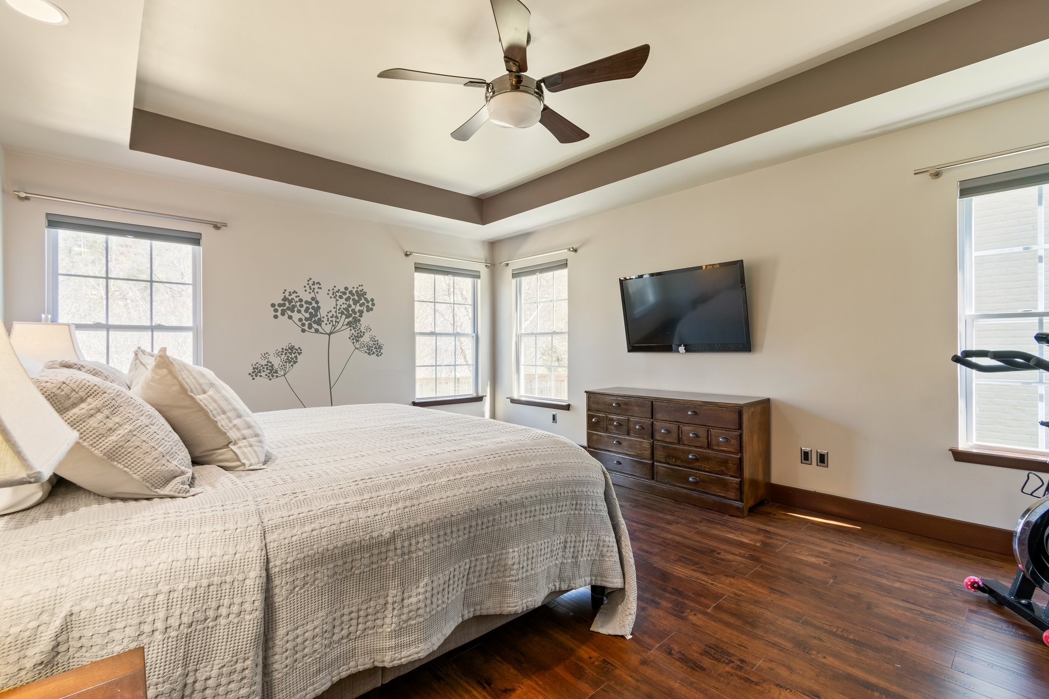 7245 Riverfront Drive Nashville, TN 37221 - Photo 37 of 74 a bedroom with a large bed a flat tv screen and dresser