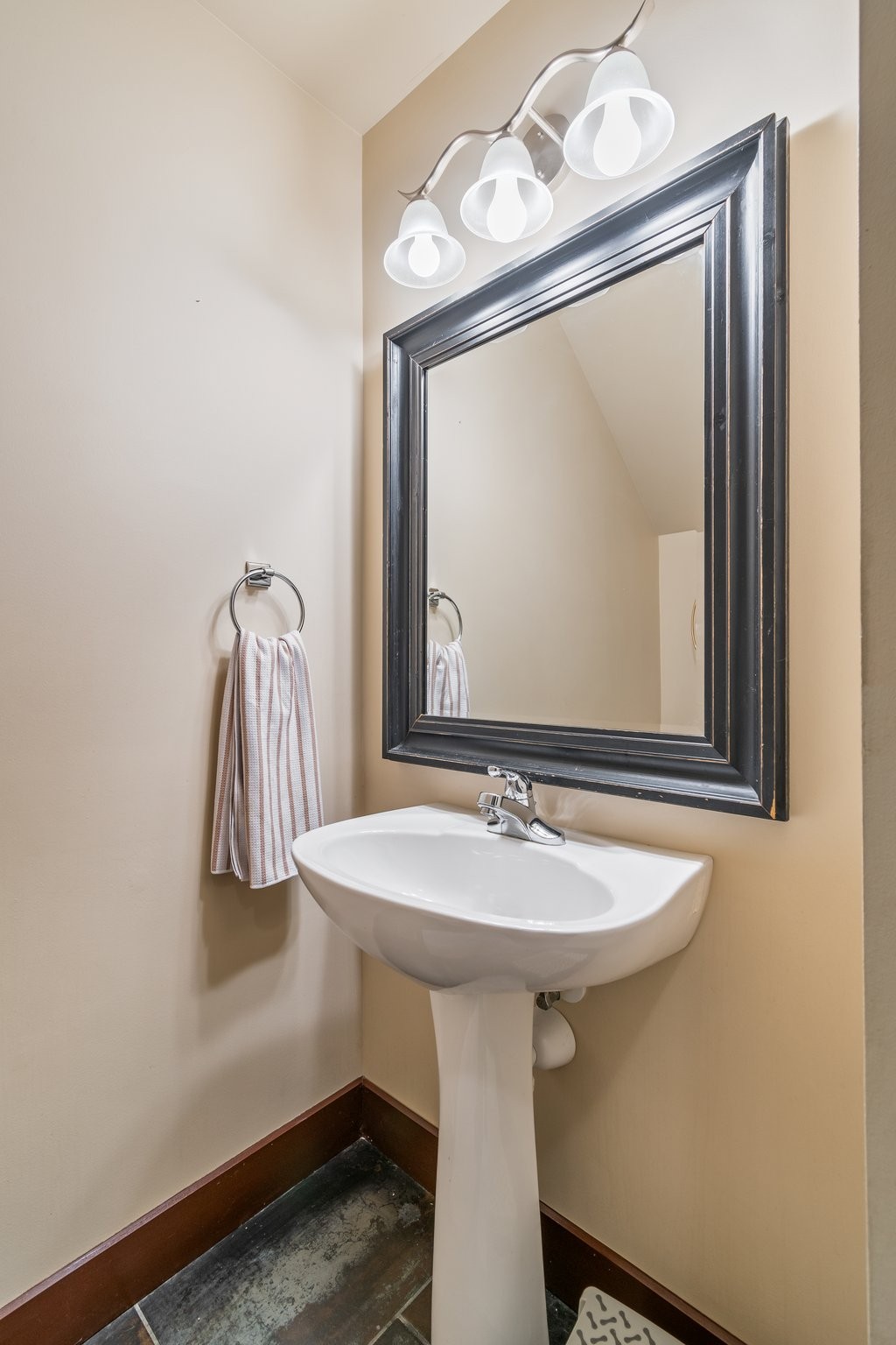 7245 Riverfront Drive Nashville, TN 37221 - Photo 43 of 74 a bathroom with a sink a mirror and vanity