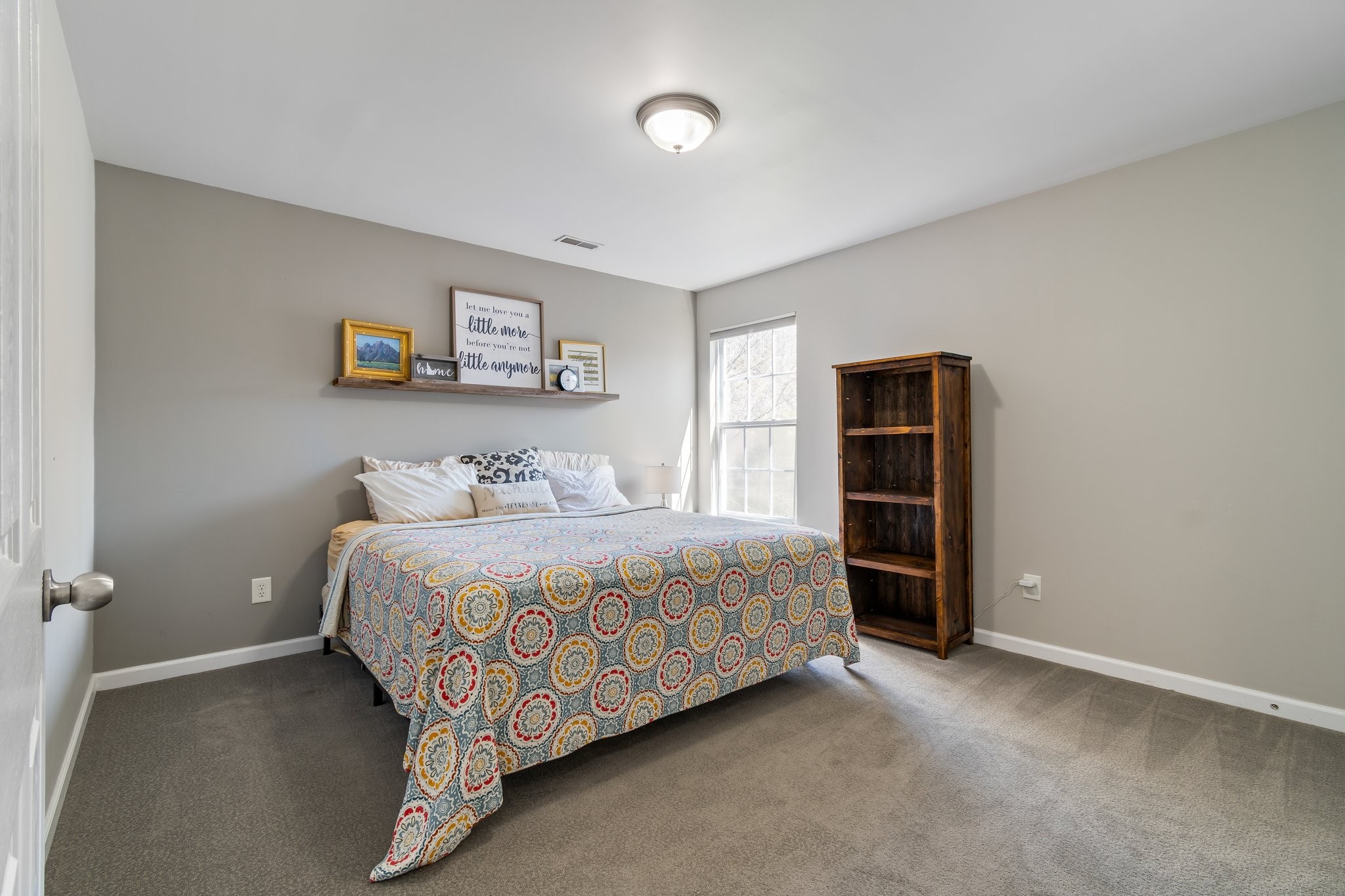 7245 Riverfront Drive Nashville, TN 37221 - Photo 50 of 74 a bedroom with a bed and a window