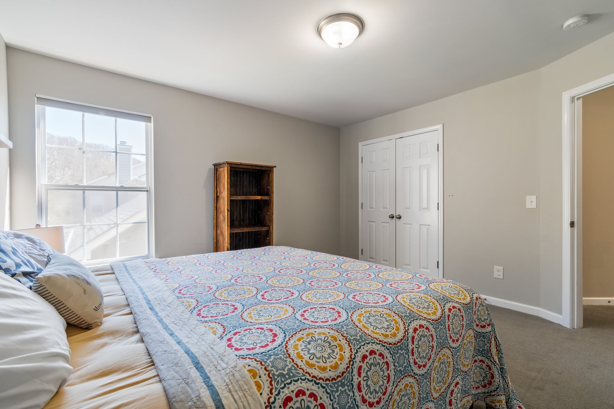 7245 Riverfront Drive Nashville, TN 37221 - Photo 52 of 74 a bedroom with a bed and a window