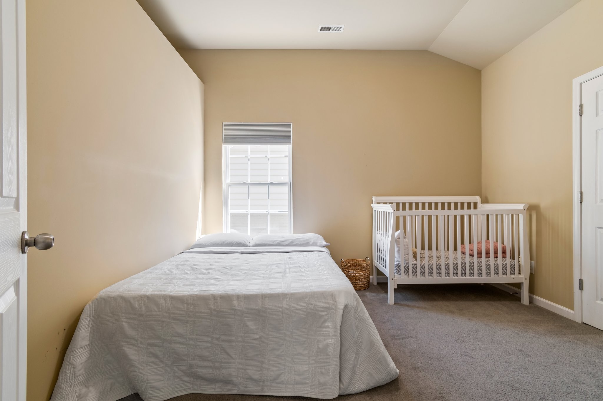 7245 Riverfront Drive Nashville, TN 37221 - Photo 54 of 74 a view of a bedroom with wooden floor and a window