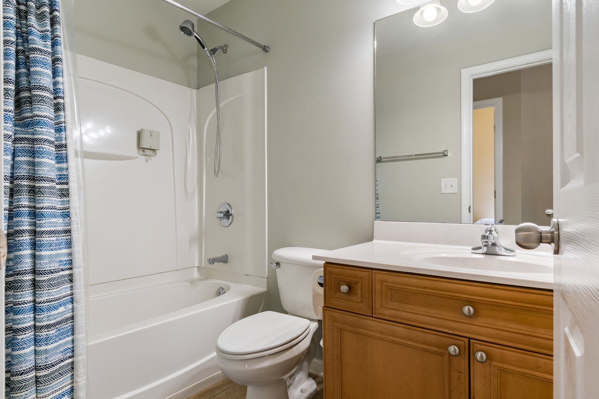 7245 Riverfront Drive Nashville, TN 37221 - Photo 55 of 74 a bathroom with a sink a toilet and shower