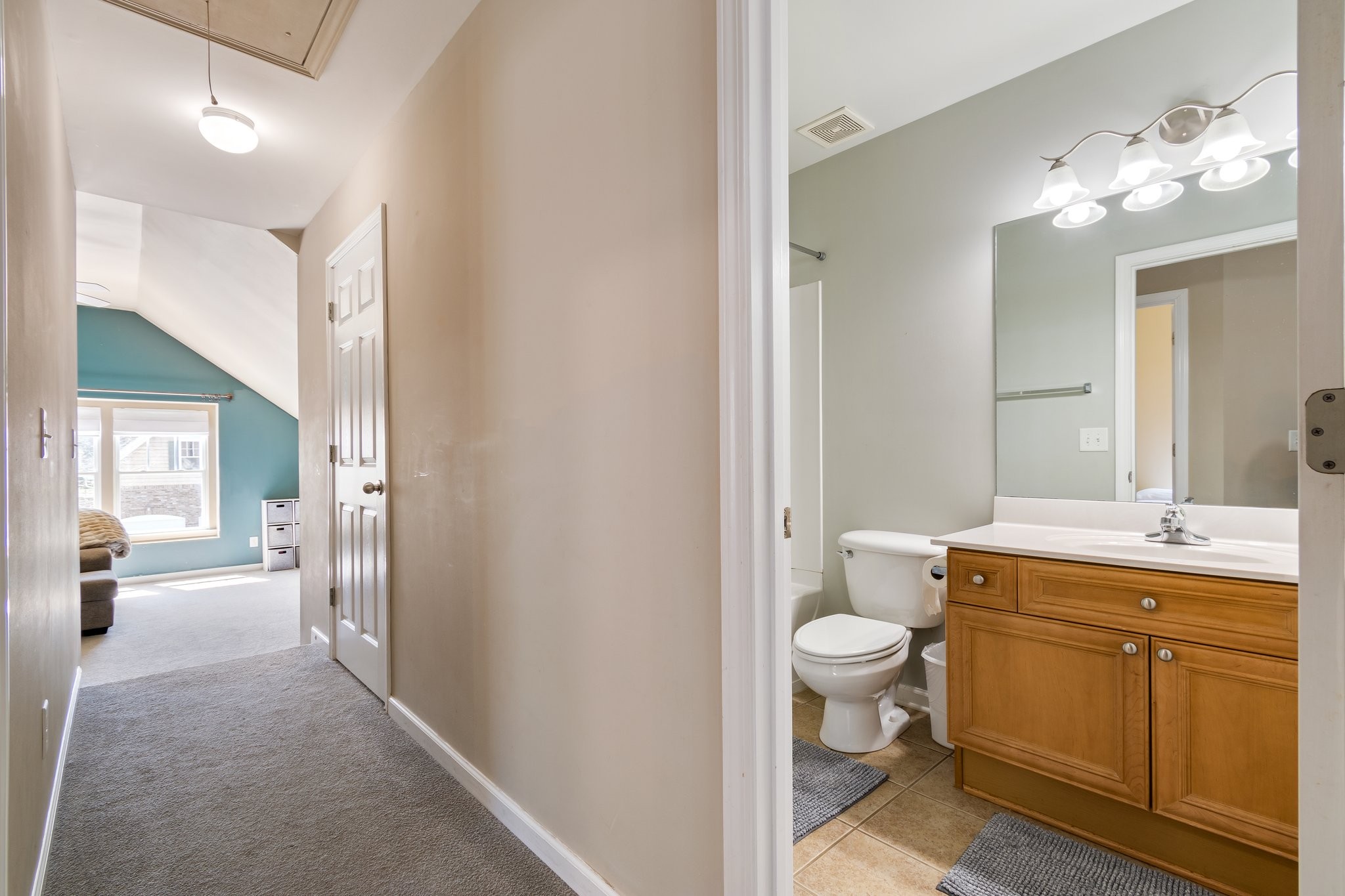 7245 Riverfront Drive Nashville, TN 37221 - Photo 56 of 74 a bathroom with a sink vanity mirror and toilet