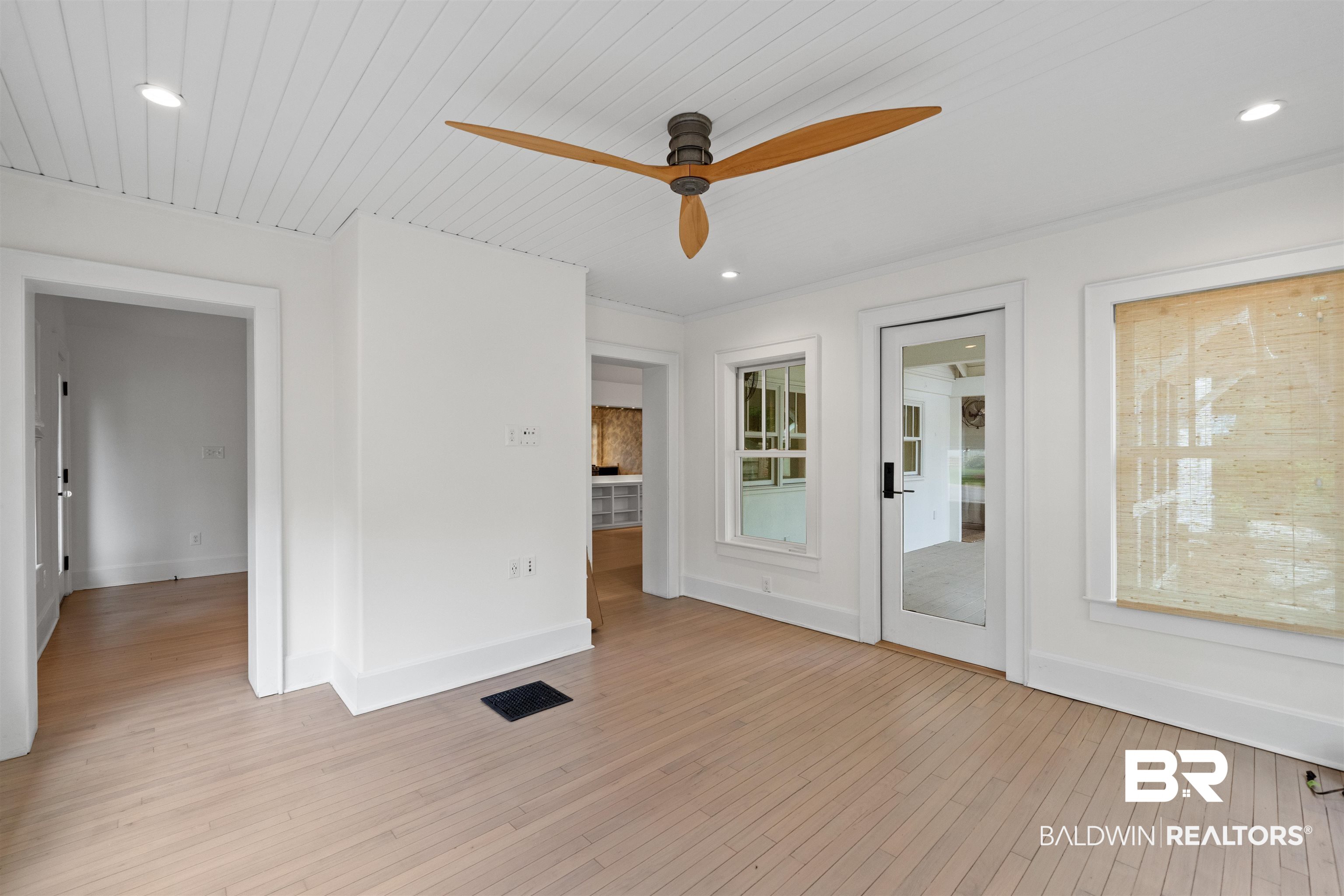 106 White Avenue Fairhope, AL 36532 - Photo 9 of 35 Unfurnished room featuring light wood-style flooring, a ceiling fan, and recessed lighting