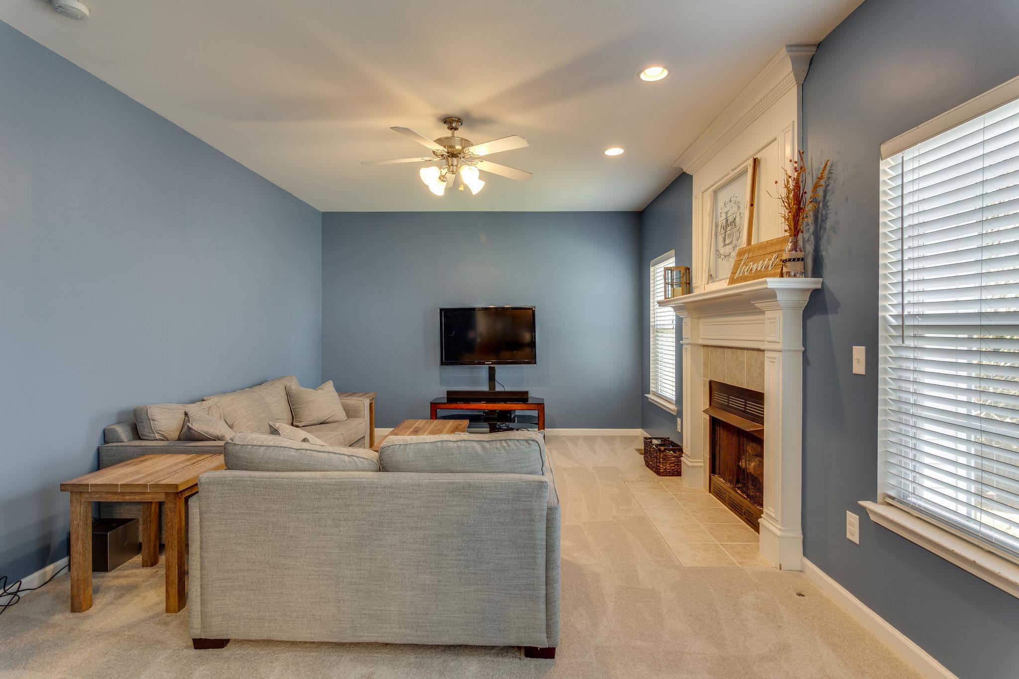 1509 Callender Road Spring Hill, TN 37174 - Photo 15 of 30 a living room with furniture and a fireplace