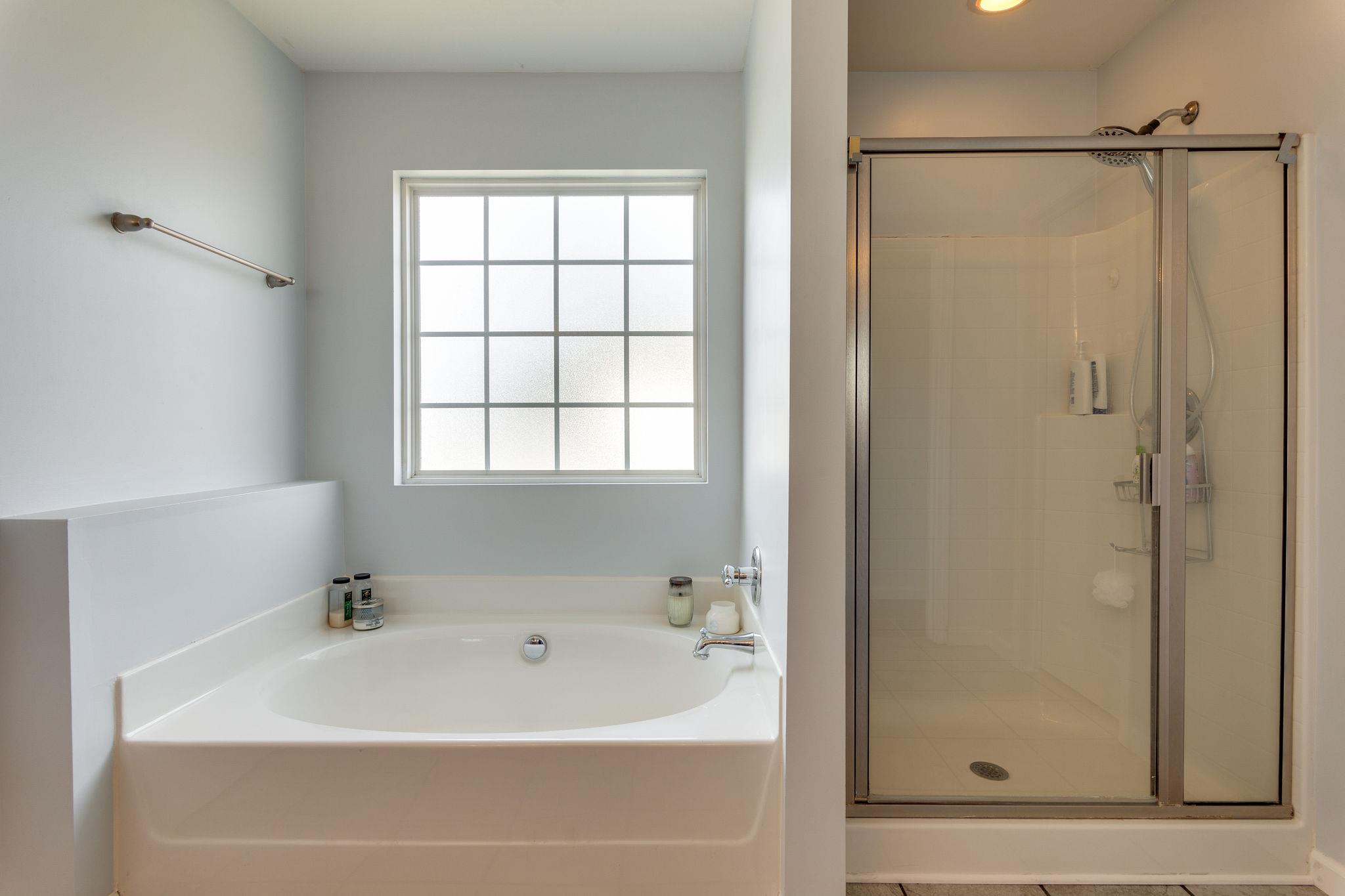 1509 Callender Road Spring Hill, TN 37174 - Photo 18 of 30 a white bath tub with a shower