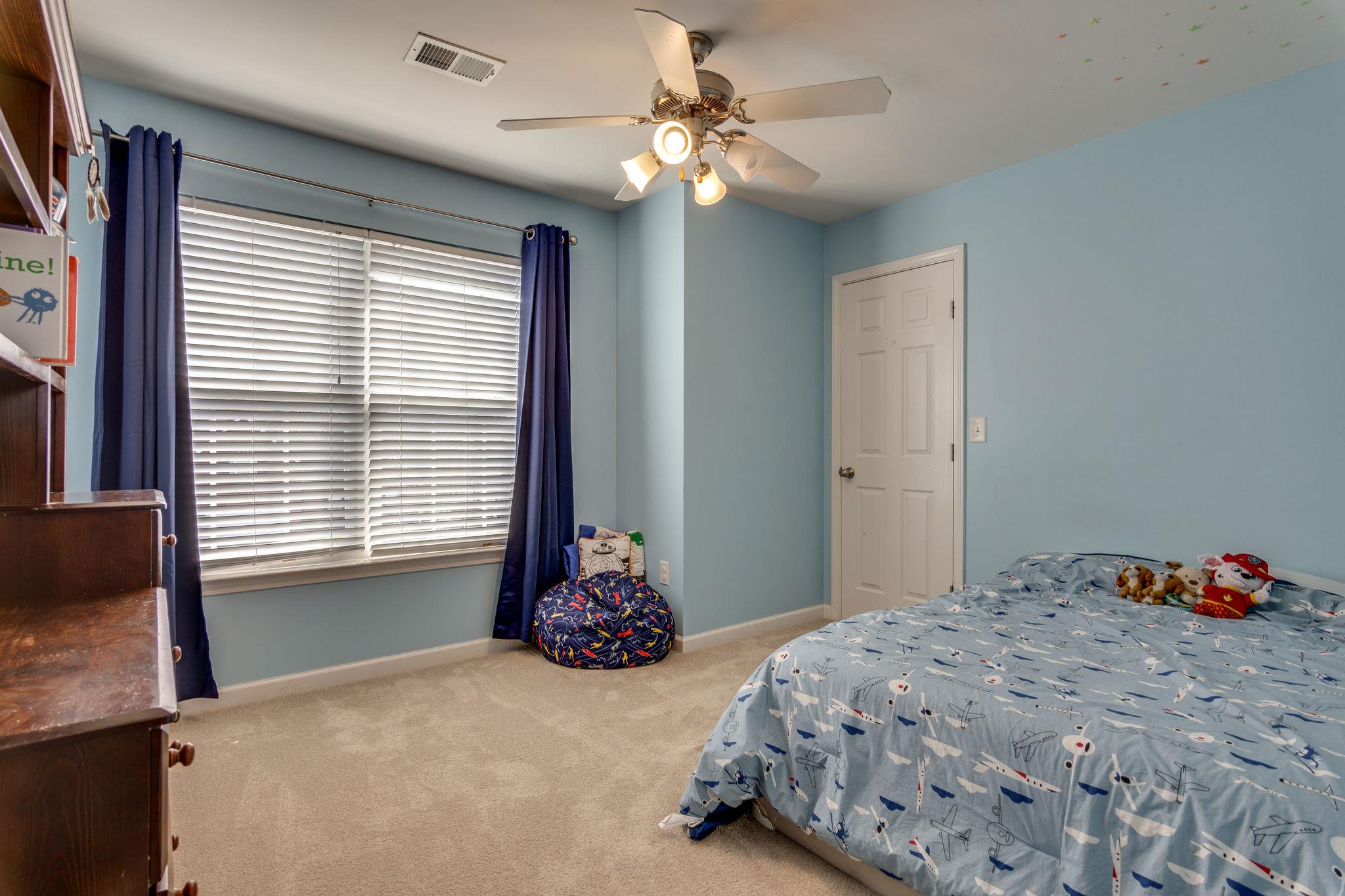 1509 Callender Road Spring Hill, TN 37174 - Photo 19 of 30 a bedroom with a bed and a window