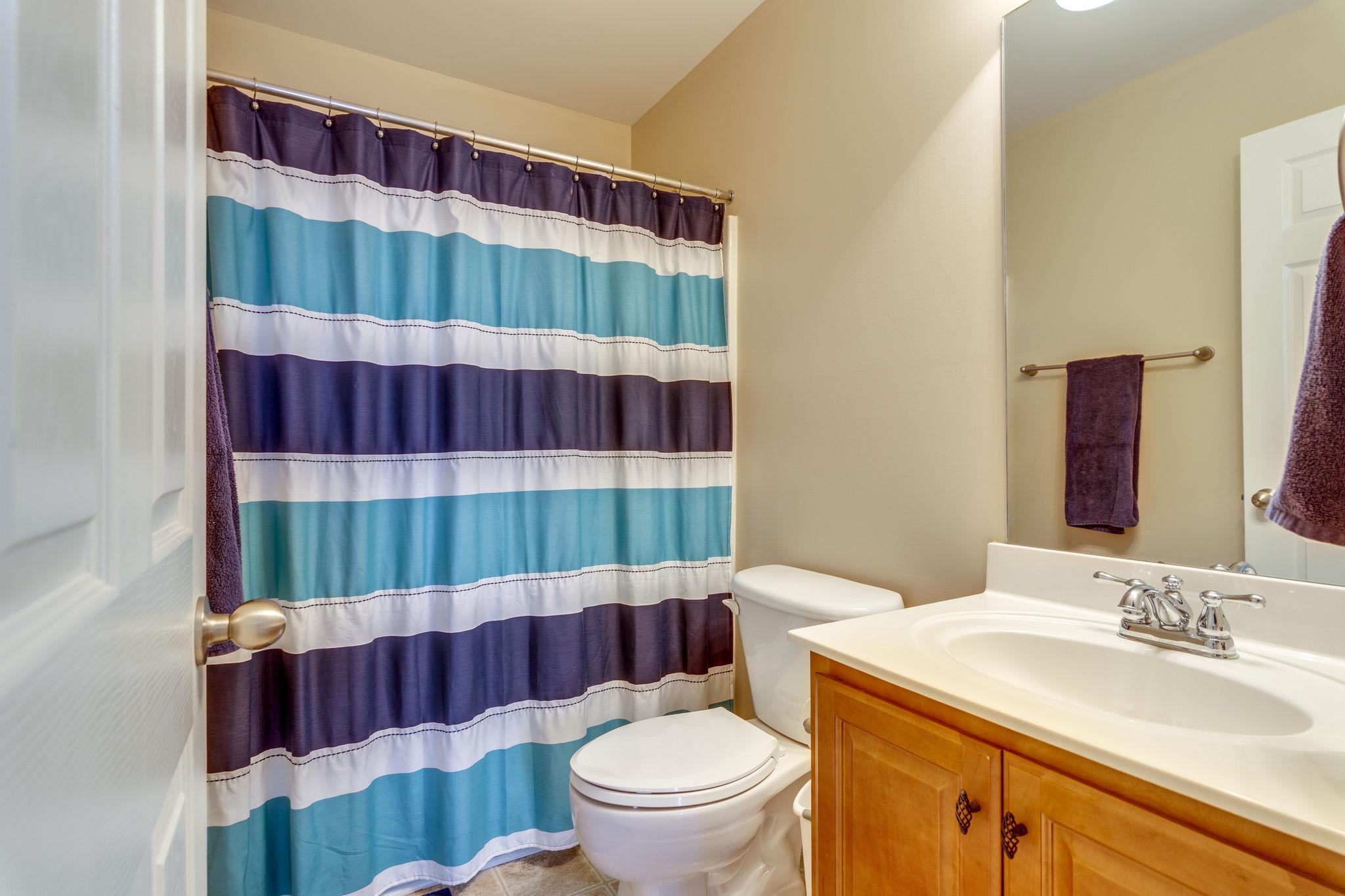 1509 Callender Road Spring Hill, TN 37174 - Photo 20 of 30 a bathroom with a sink and a mirror
