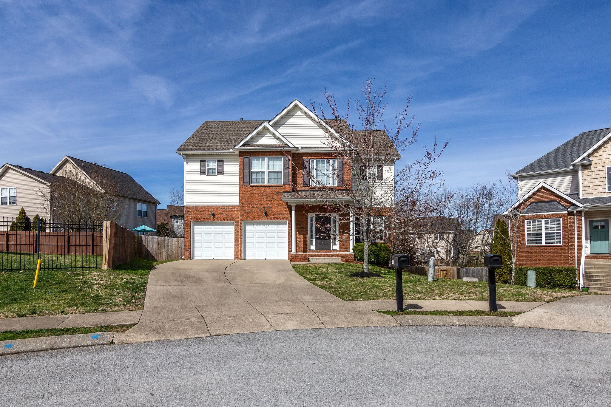 1509 Callender Road Spring Hill, TN 37174 - Photo 2 of 30 a front view of a house with a yard and garage