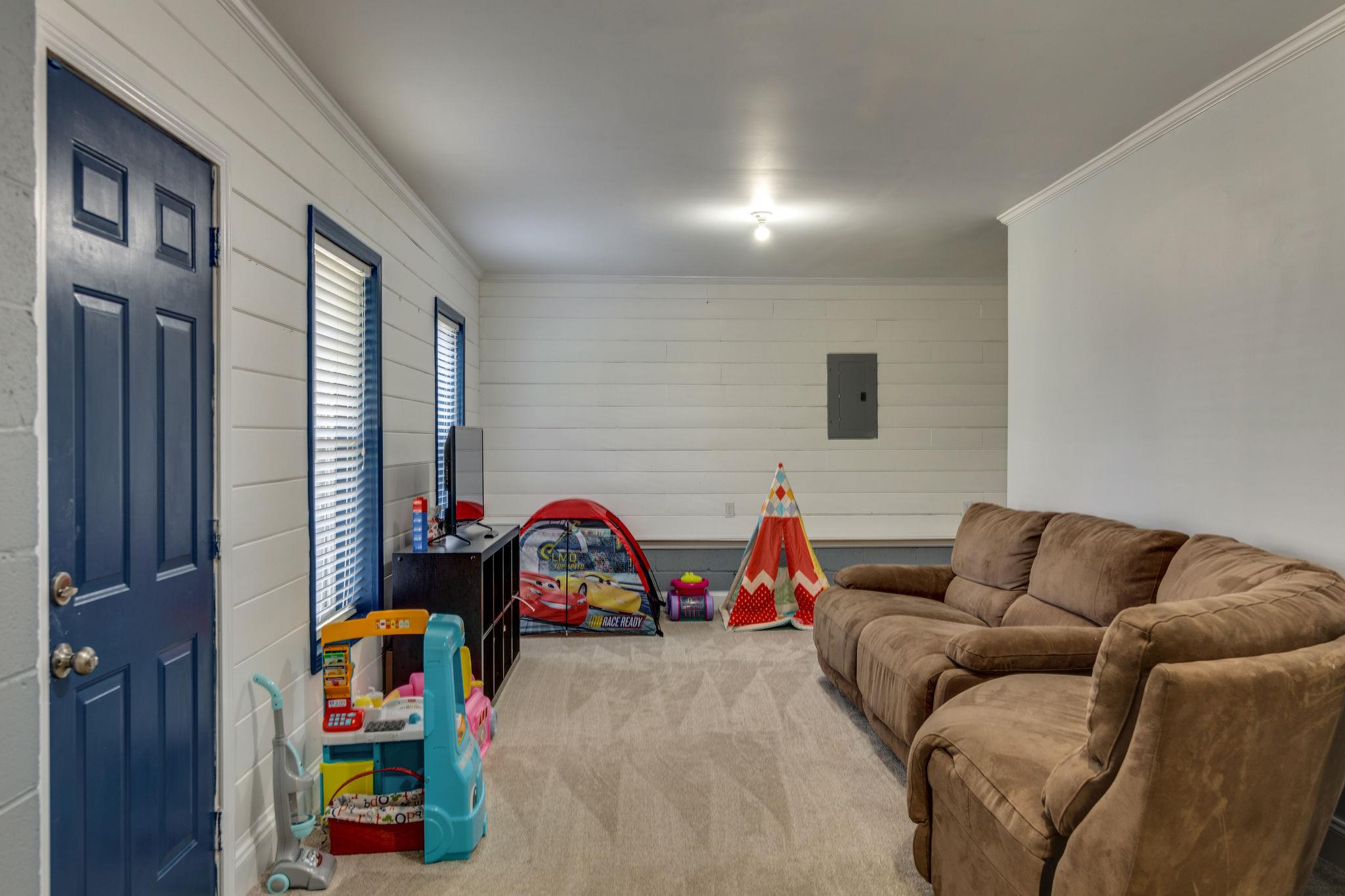 1509 Callender Road Spring Hill, TN 37174 - Photo 23 of 30 a bedroom with furniture and a couch