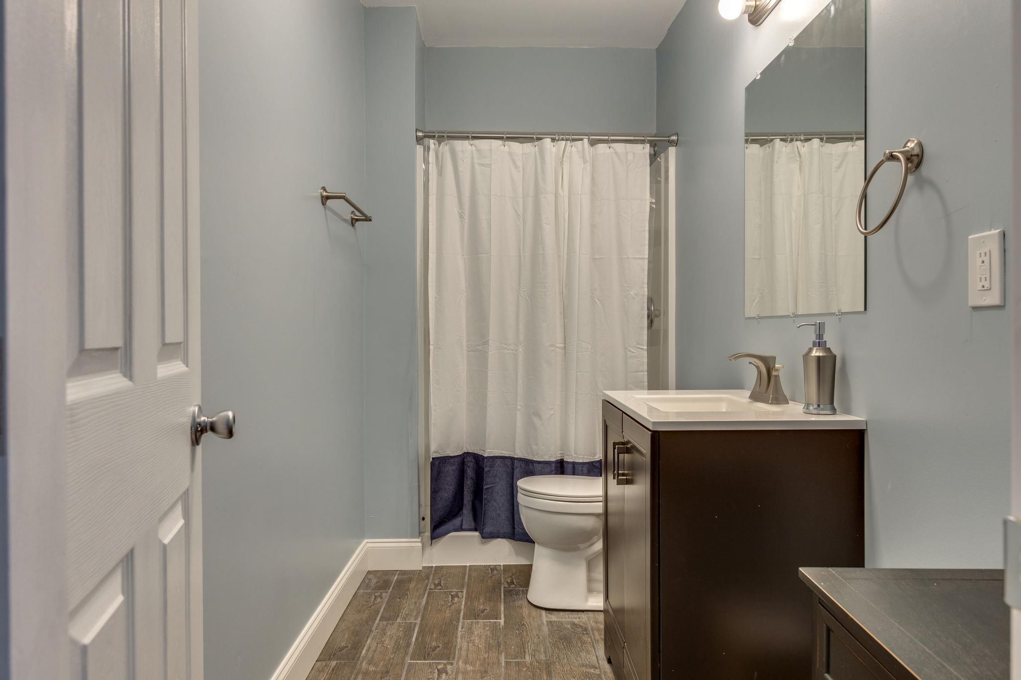 1509 Callender Road Spring Hill, TN 37174 - Photo 26 of 30 a bathroom with a sink toilet and shower
