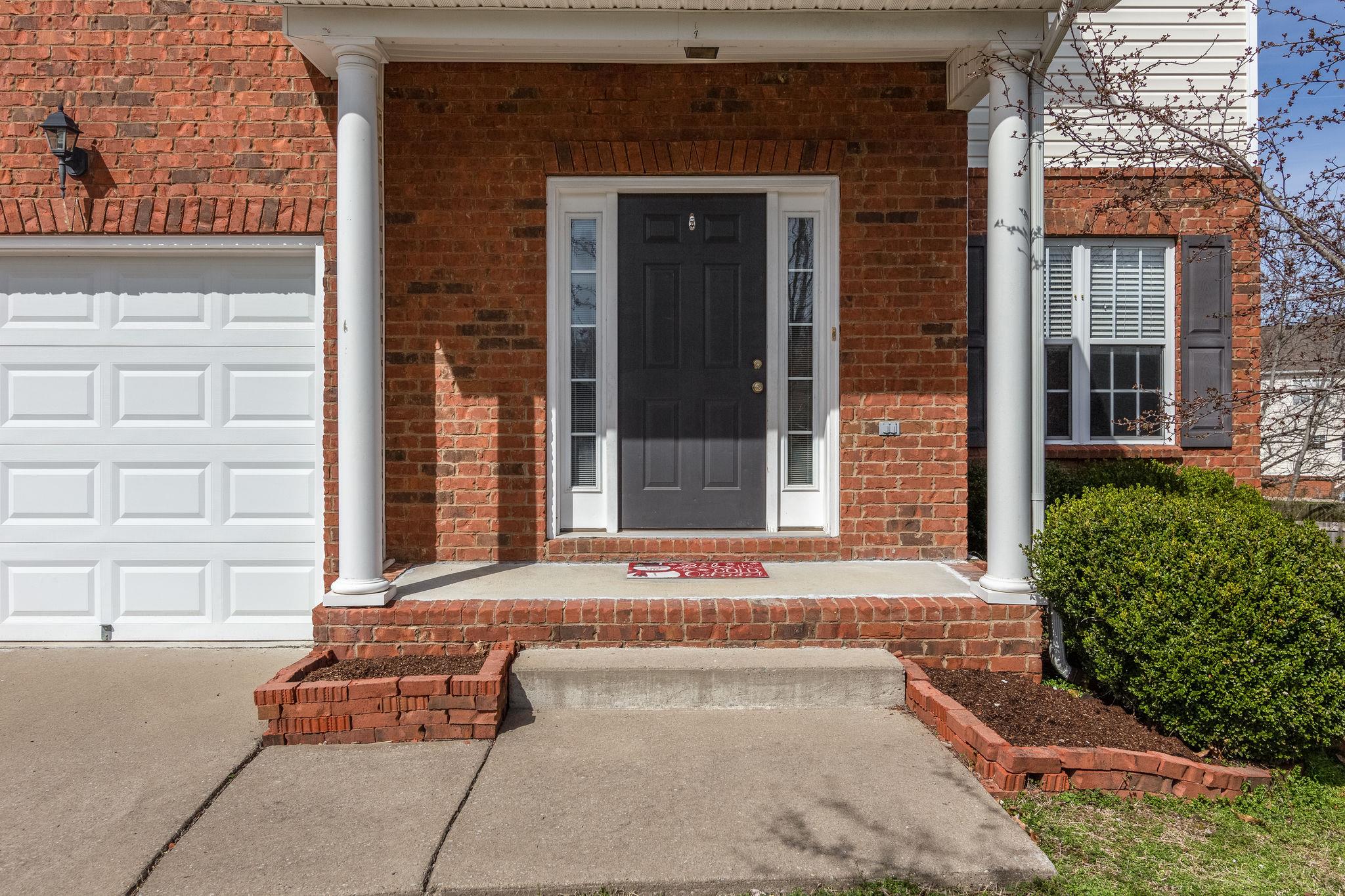 1509 Callender Road Spring Hill, TN 37174 - Photo 3 of 30 a front view of a house with a yard