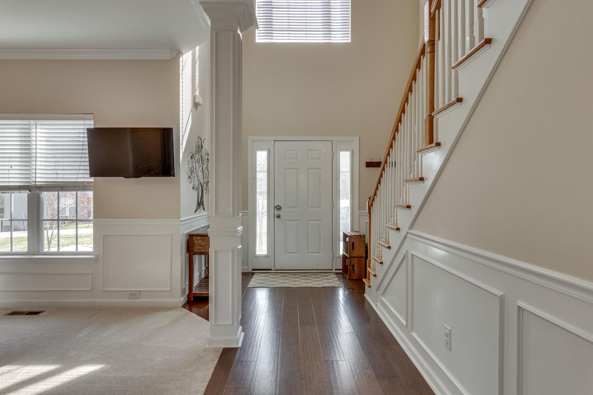 1509 Callender Road Spring Hill, TN 37174 - Photo 4 of 30 a view of hallway with stairs and wooden floor