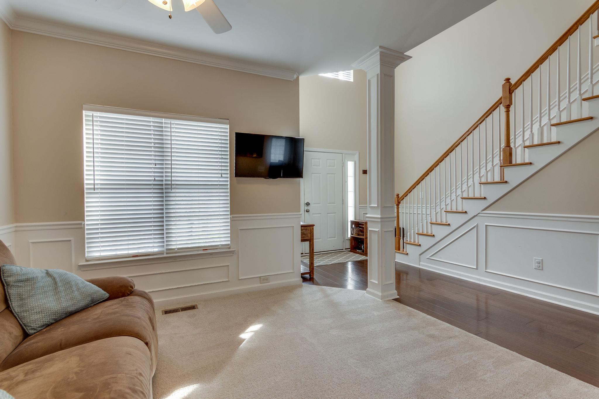 1509 Callender Road Spring Hill, TN 37174 - Photo 5 of 30 a living room with furniture and a flat screen tv
