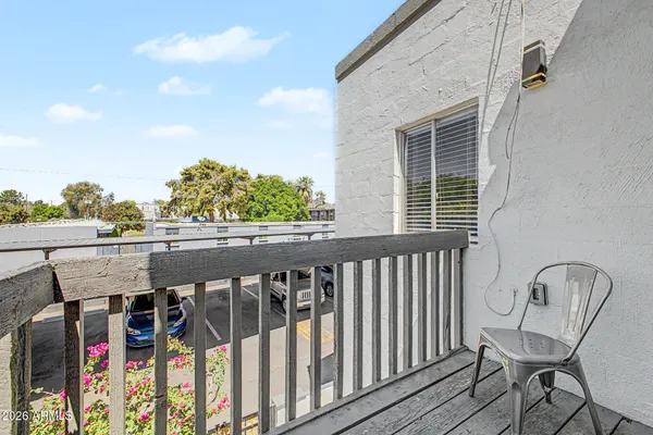 a view of balcony with furniture