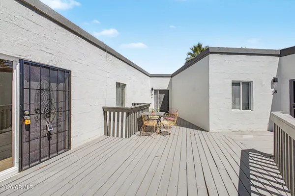 a view of outdoor space with deck and furniture