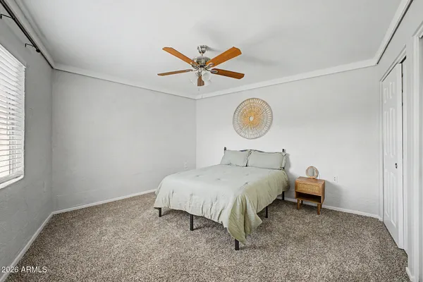 a bed room with a bed and a window