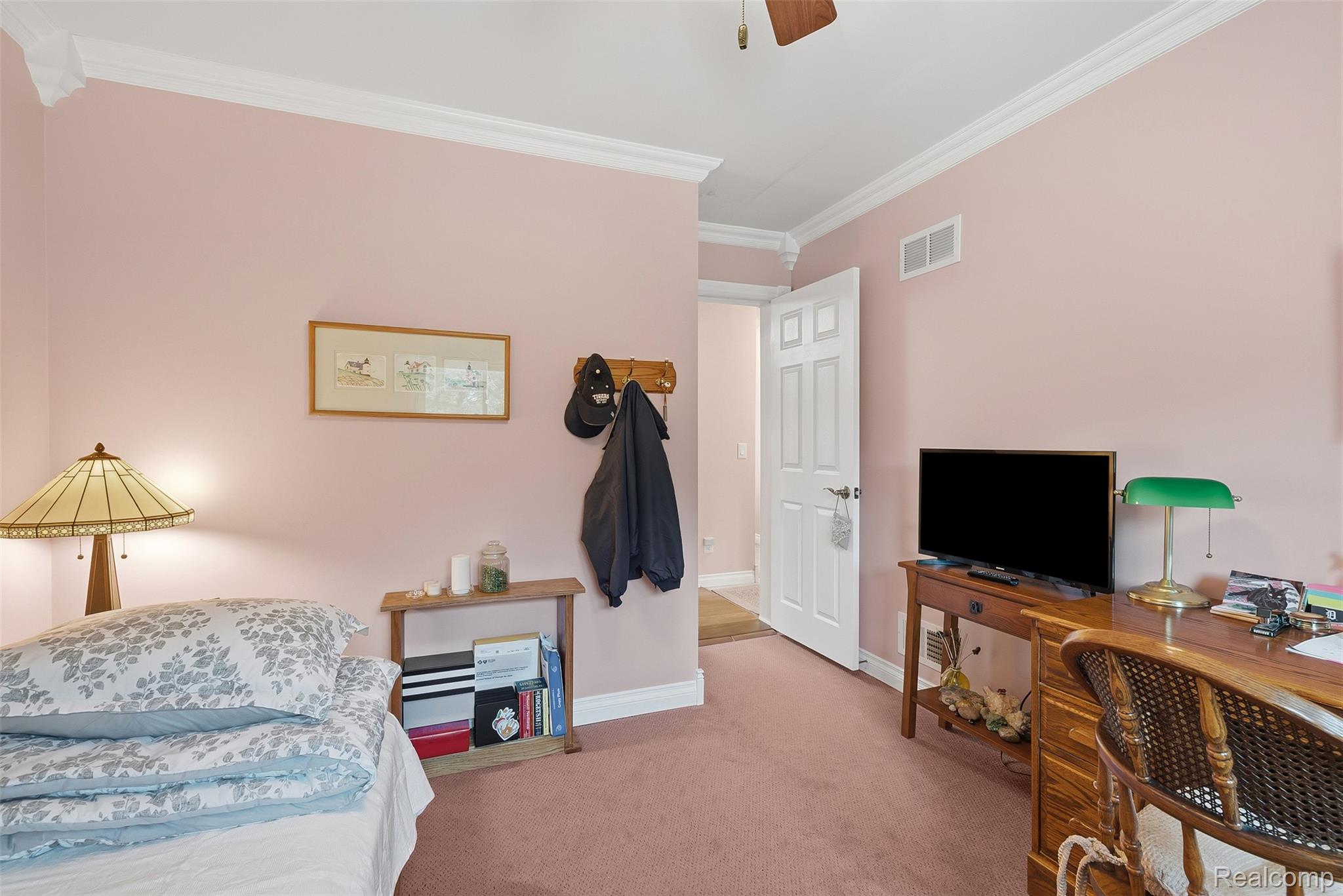 13182 Gilbert Road Memphis, MI 48041 - Photo 20 of 48 Carpeted room with a white door, crown molding, and a ceiling fan