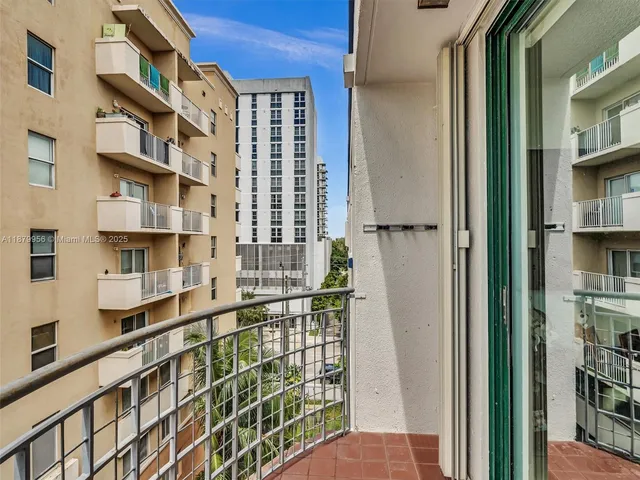 a picture of a brick house with many windows