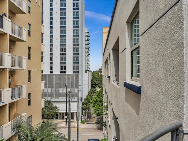 a view of balcony with furniture