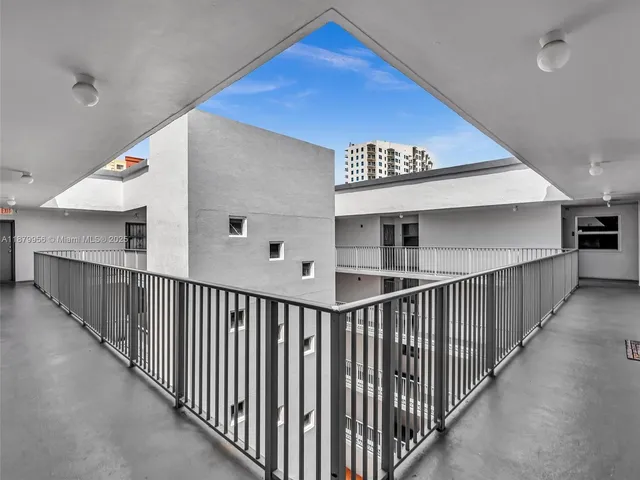 a view of a balcony with fence