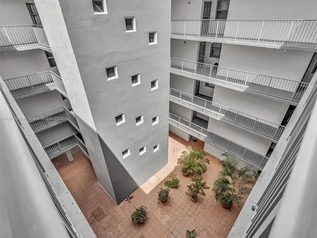 a view of a balcony with a floor to ceiling window