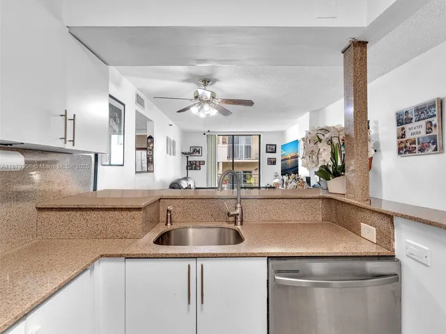 a kitchen with a sink and refrigerator