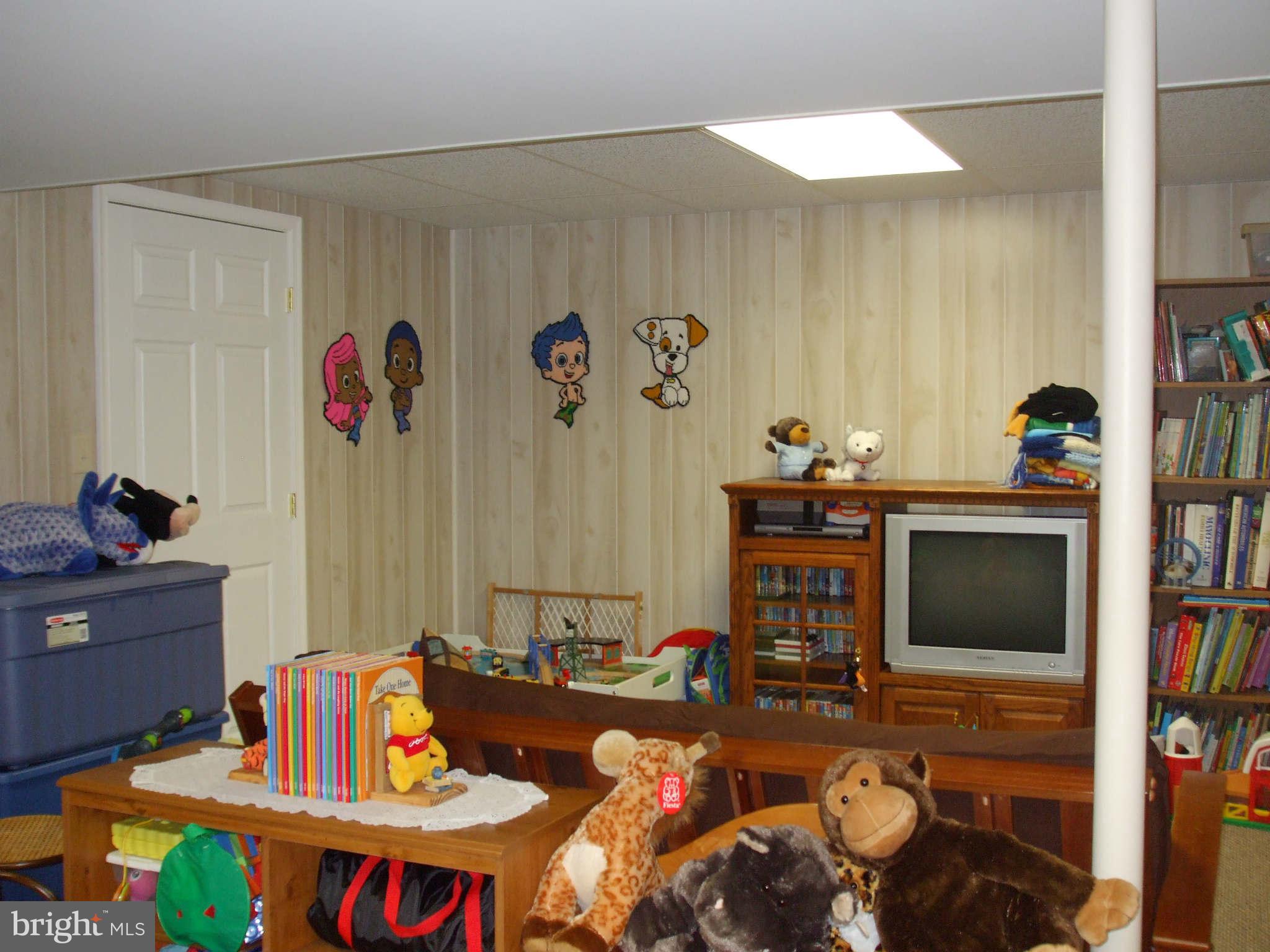595 Ridgewood Road Bel Air, MD 21014 - Photo 25 of 26 a living room with furniture and a flat screen tv
