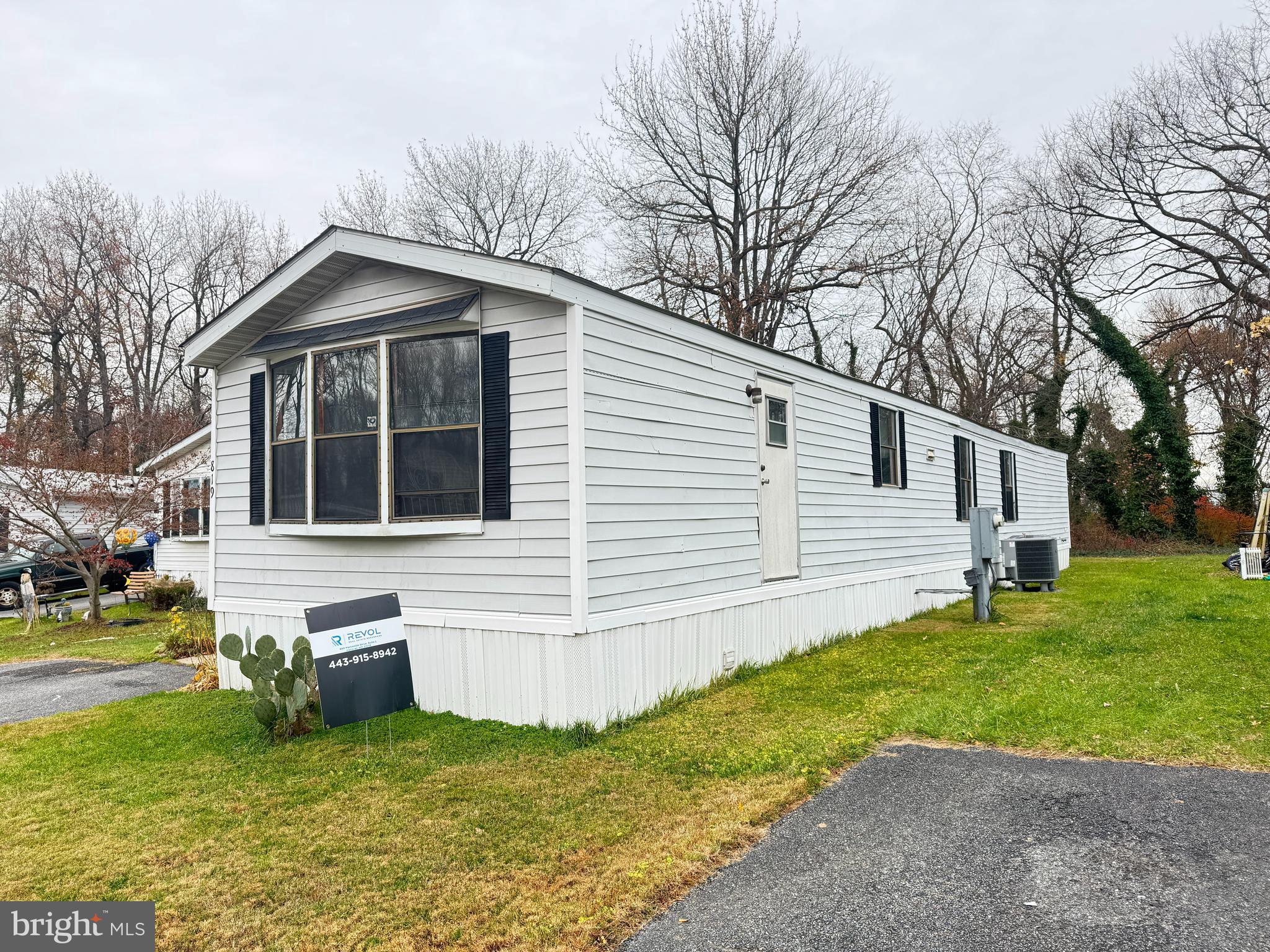 819 Leswood Court Dundalk, MD 21222 - Photo 17 of 18 a front view of house with yard and green space