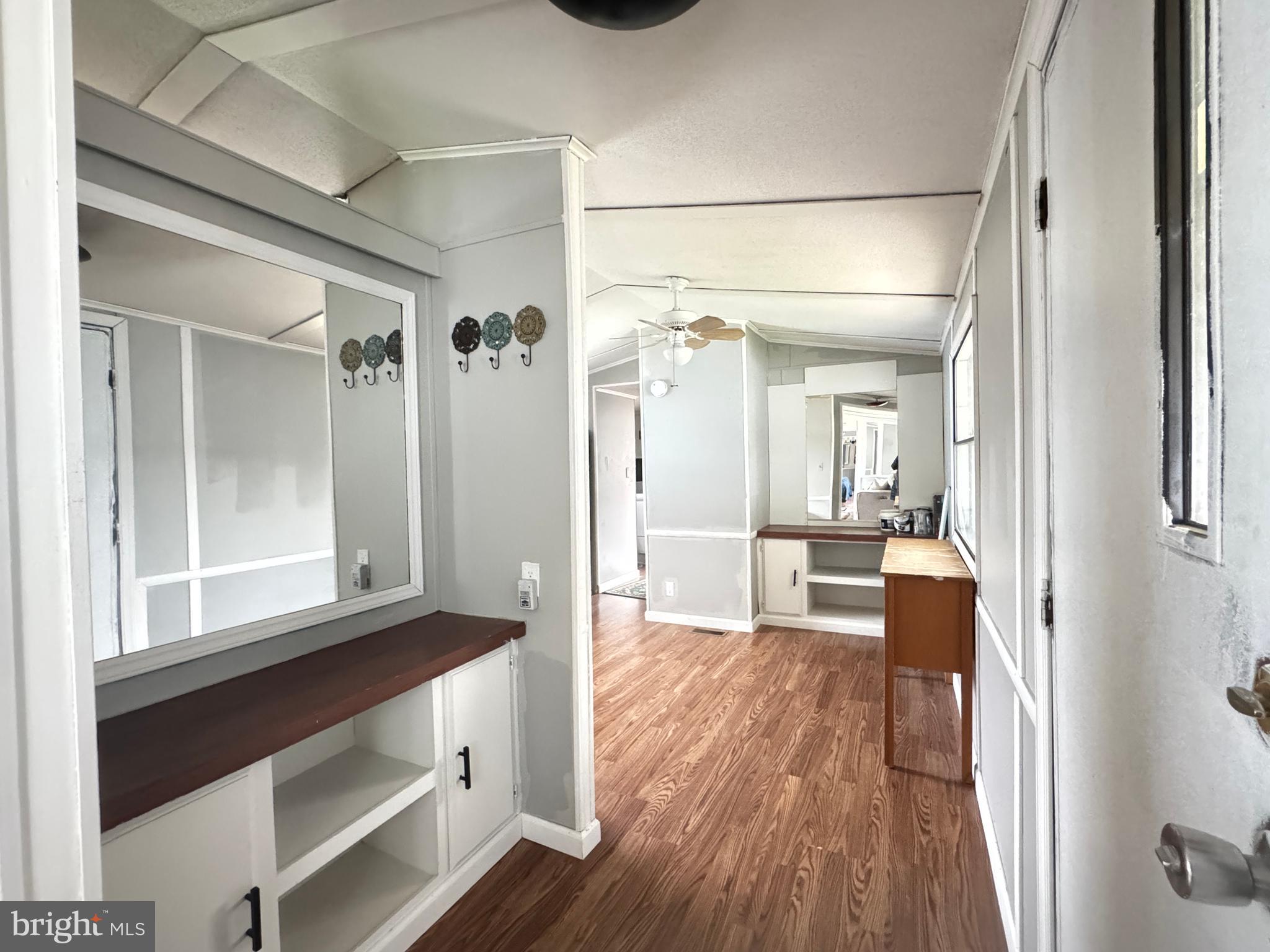 819 Leswood Court Dundalk, MD 21222 - Photo 4 of 18 a view of a hallway view with wooden floor and furniture