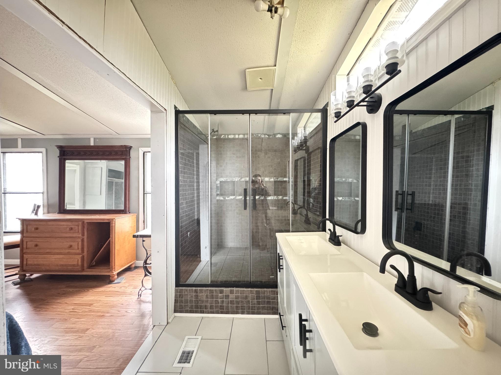 819 Leswood Court Dundalk, MD 21222 - Photo 8 of 18 a bathroom with a tub sink and mirror