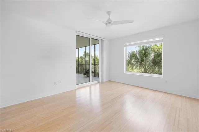 a bathroom with a bathtub shower sink vanity and toilet