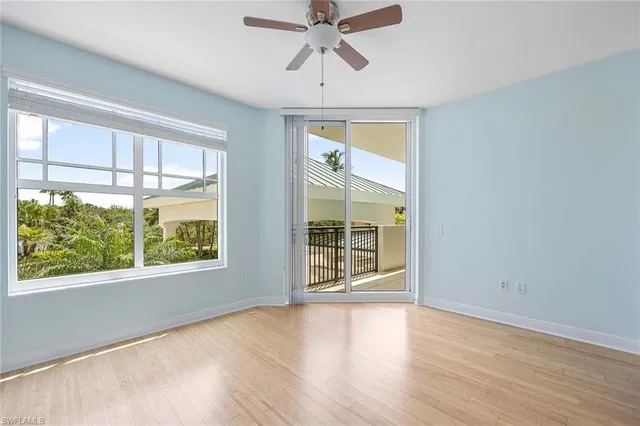 a bathroom with a shower sink vanity mirror and toilet