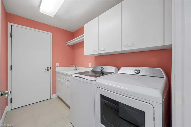 a balcony with furniture and a potted plant