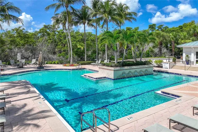 a view of a swimming pool with a patio