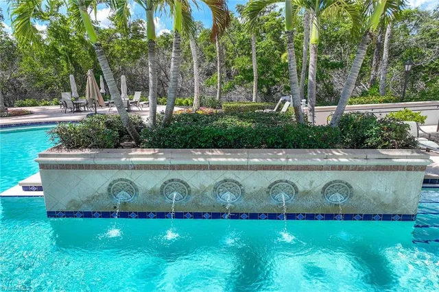a front view of house with yard and outdoor seating