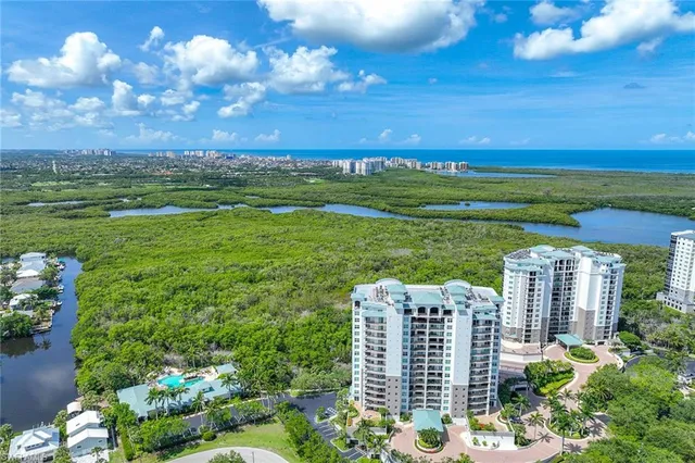 a view of a lake with houses in the back