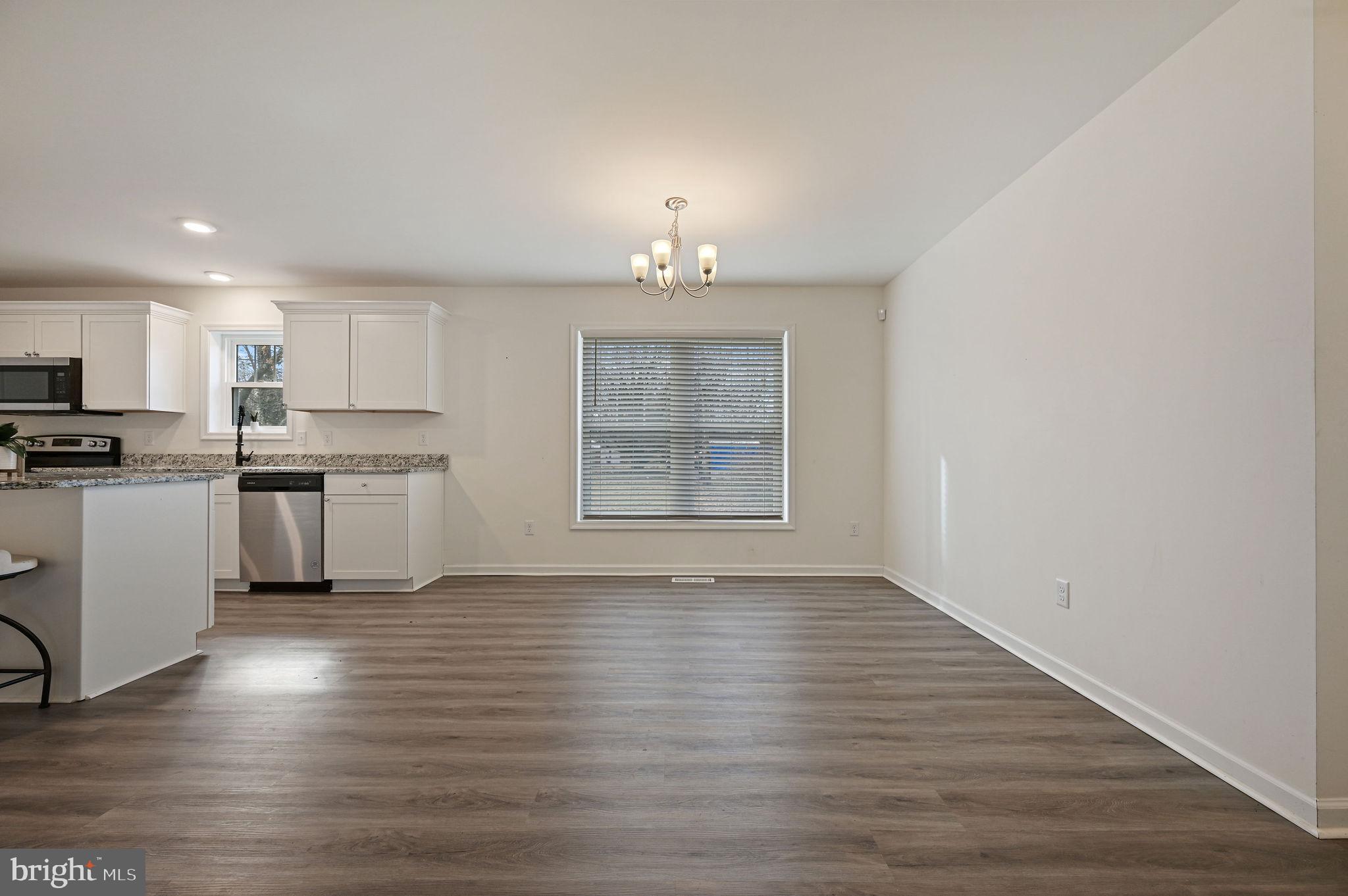 4 Senator Avenue Dover, DE 19901 - Photo 20 of 26 a view of kitchen with wooden floor electronic appliances and window
