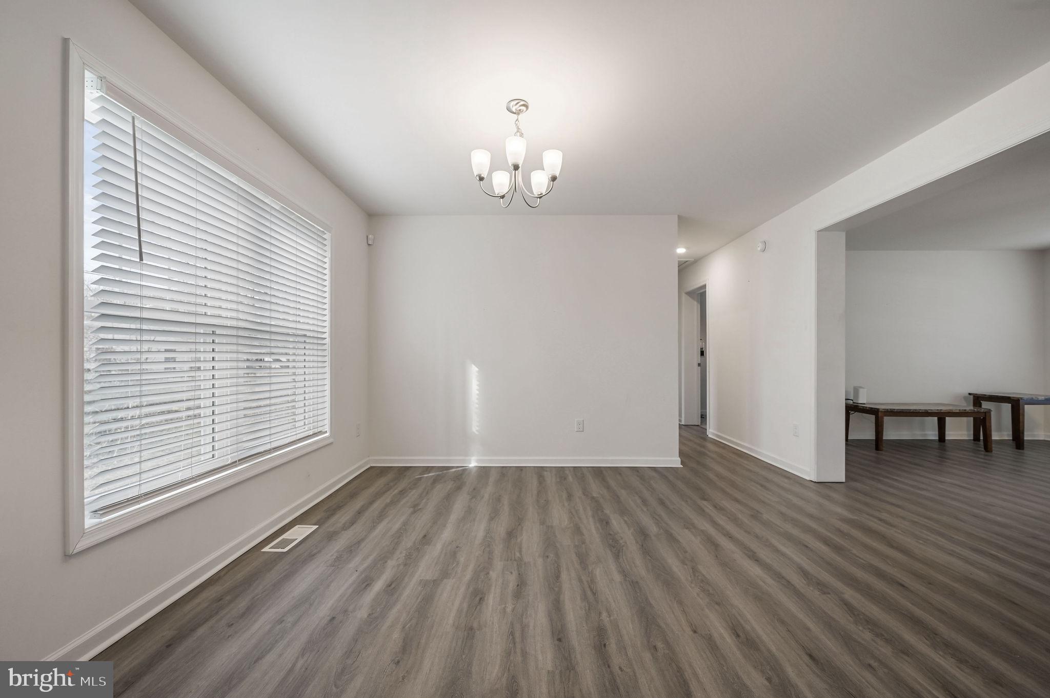 4 Senator Avenue Dover, DE 19901 - Photo 22 of 26 wooden floor in an empty room with a window