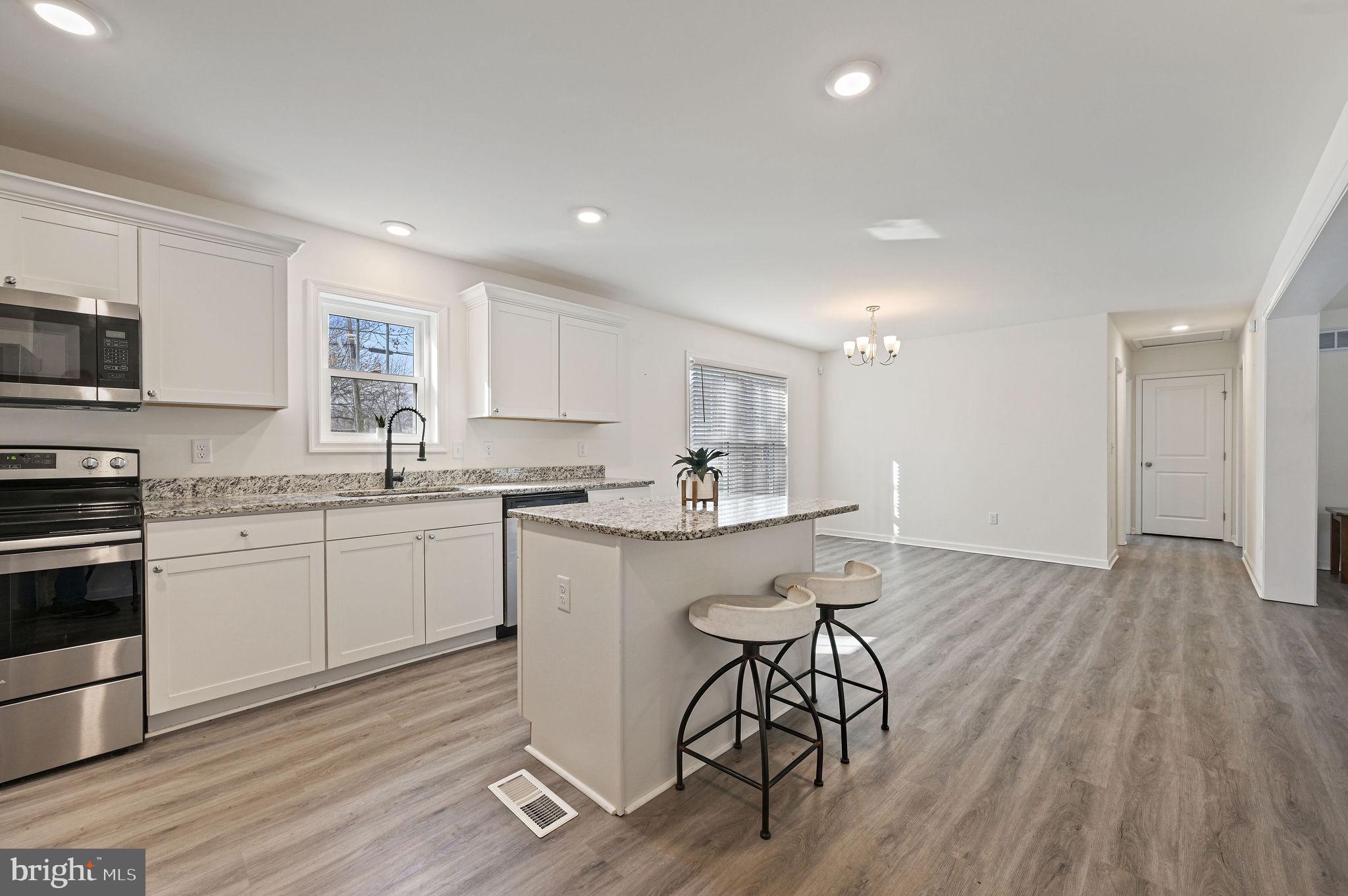 4 Senator Avenue Dover, DE 19901 - Photo 6 of 26 a kitchen with a sink cabinets and wooden floor