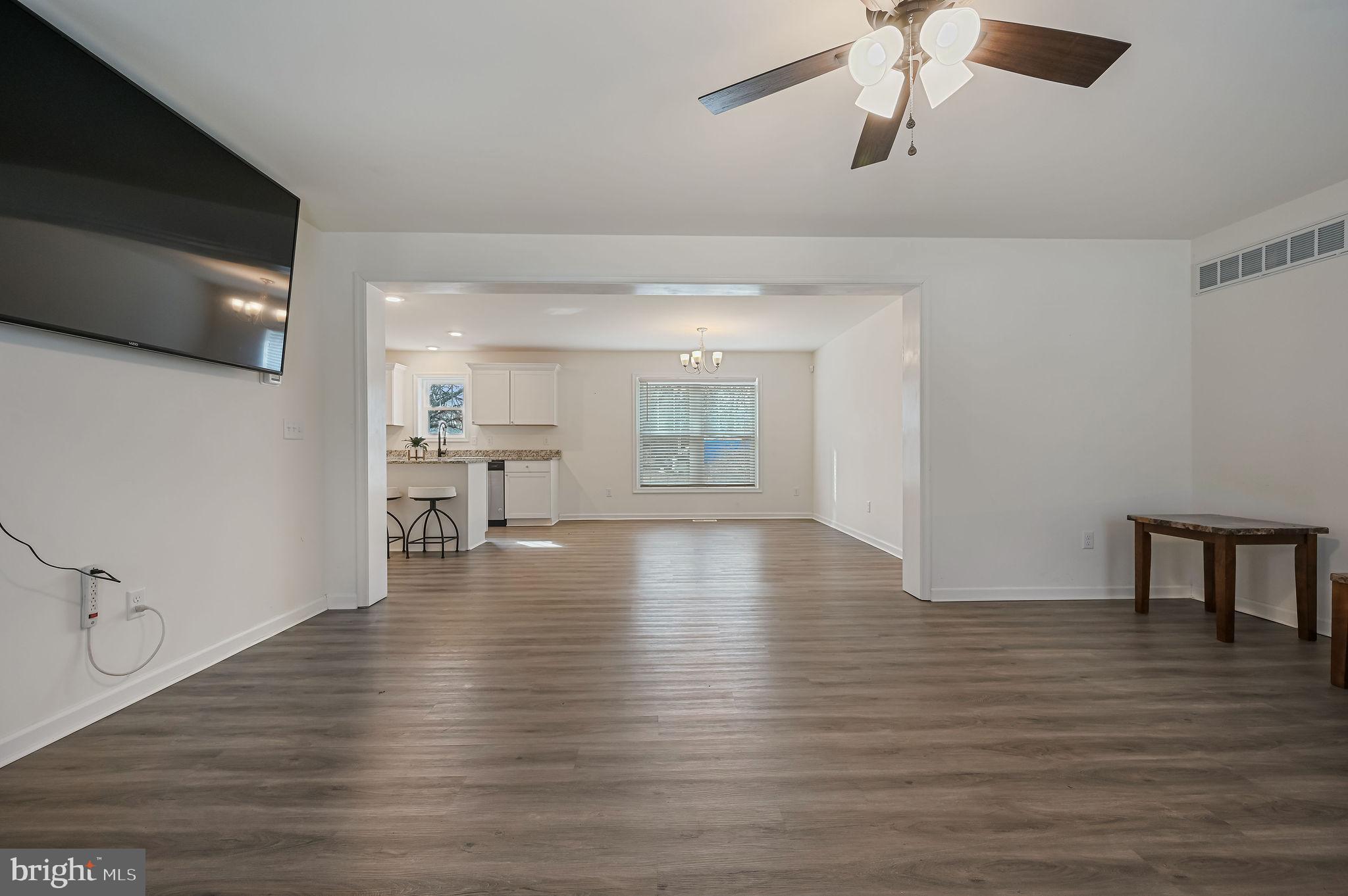 4 Senator Avenue Dover, DE 19901 - Photo 8 of 26 a view of an empty room with wooden floor and a window