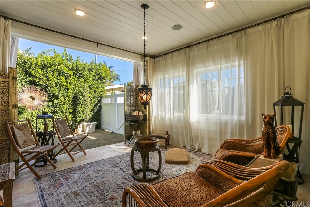 Off the kitchen, enjoy warm summer nights and afternoon ocean breezes in the enclosed covered patio, which is an approximately 185 square feet California Room and features surround sound speakers!